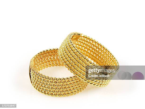 pair of gold wedding rings - bacelet stock pictures, royalty-free photos & images