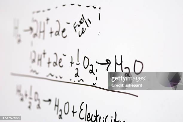 out of focus photograph of fuel cell equations on whiteboard - formula stock pictures, royalty-free photos & images