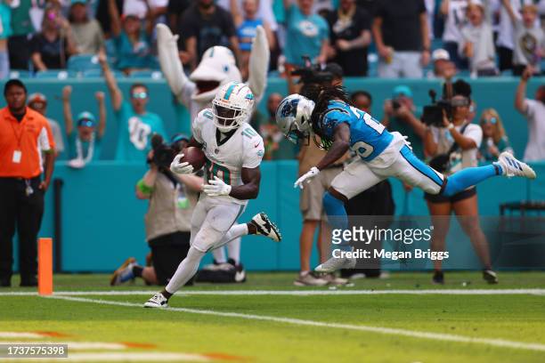 Tyreek Hill of the Miami Dolphins runs the ball in for a touchdown during the first half in the game against the Carolina Panthers at Hard Rock...