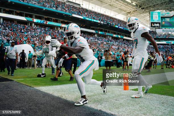 Tyreek Hill of the Miami Dolphins celebrates a touchdown during the first half in the game against the Carolina Panthers at Hard Rock Stadium on...