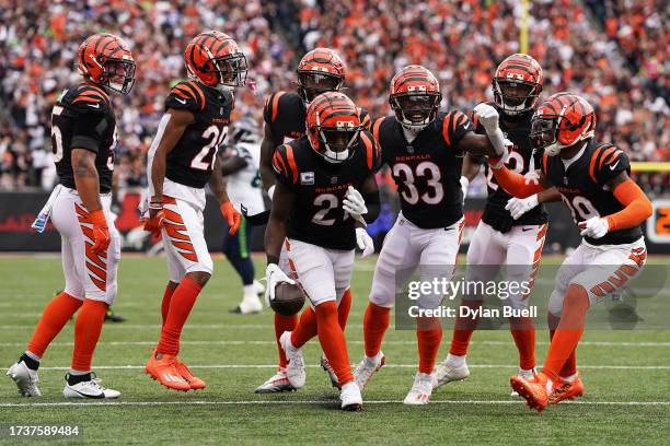Mike Hilton of the Cincinnati Bengals celebrates with teammates after making an interception during the third quarter against the Seattle Seahawks at...
