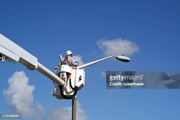 lineworker 4 - street light stock pictures, royalty-free photos & images