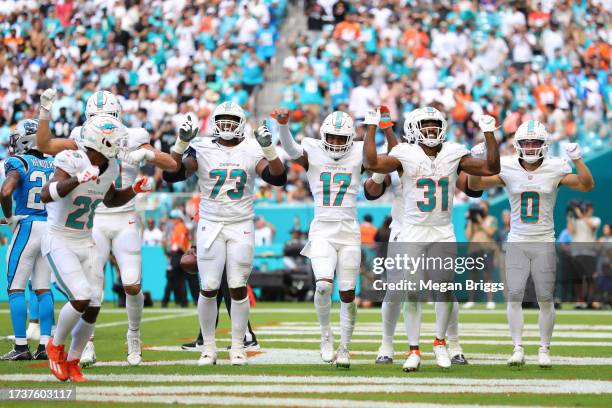 Raheem Mostert of the Miami Dolphins celebrates a touchdown with teammates during the third quarter in the game against the Carolina Panthers at Hard...