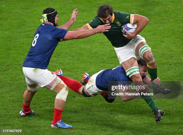 Eben Etzebeth of South Africa is tackled by Anthony Jelonch of France whilst under pressure from Gregory Alldritt during the Rugby World Cup France...