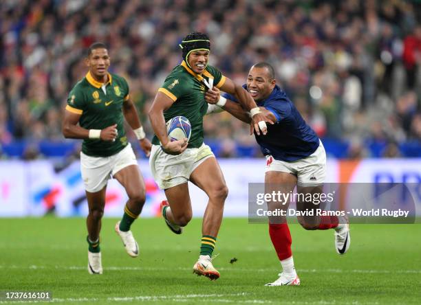 Kurt-Lee Arendse of South Africa is tackled by Gael Fickou of France during the Rugby World Cup France 2023 Quarter Final match between France and...