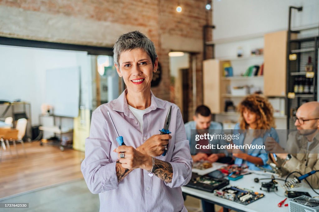 Computer Shop Hoding Electronics Professor Holding Computer Repair Tool High-Res Stock Photo ...