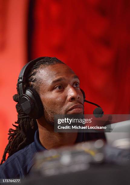 Professional Football players Larry Fitzgerald attends the SiriusXM Celebrity Fantasy Football Draft at Hard Rock Cafe - Times Square on July 17,...