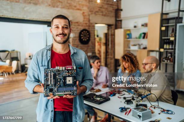 man holding circuit board - computer taken apart stock pictures, royalty-free photos & images
