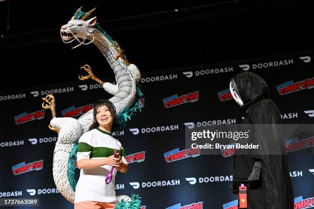 Contestant posing as Chihiro and Haru from Spirited Away at the Cosplay Central Costume Showcase during New York Comic Con 2023 - Day 4 at Javits...