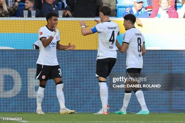 Frankfurt's German forward Ansgar Knauff celebrates scoring a goal with teammates during the German first division Bundesliga football match between...