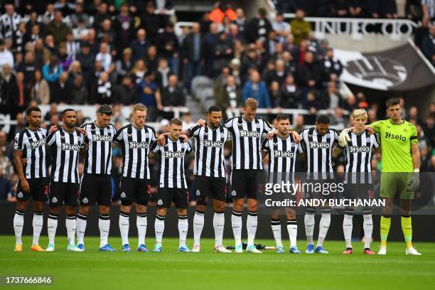 Newcastle players observe a minute's silence to honour the victims of the Hamas attacks in Israel and ongoing actions in Gaza, before kick off in the...