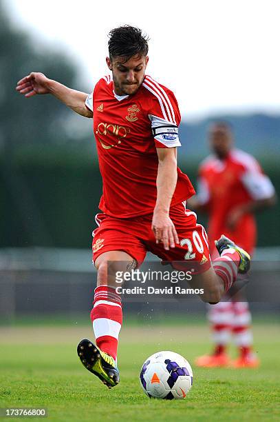 Adam Lallana of Southampton kicks the ball during a friendly match between Southampton FC and UE Llagostera at the Josep Pla i Arbones Stadium on...