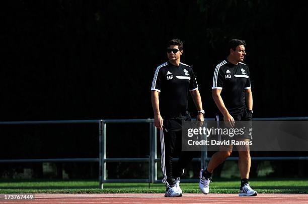 First team manager Mauricio Pochettino and tirst team coach Miguel D'Agostino looks on before a friendly match between Southampton FC and UE...