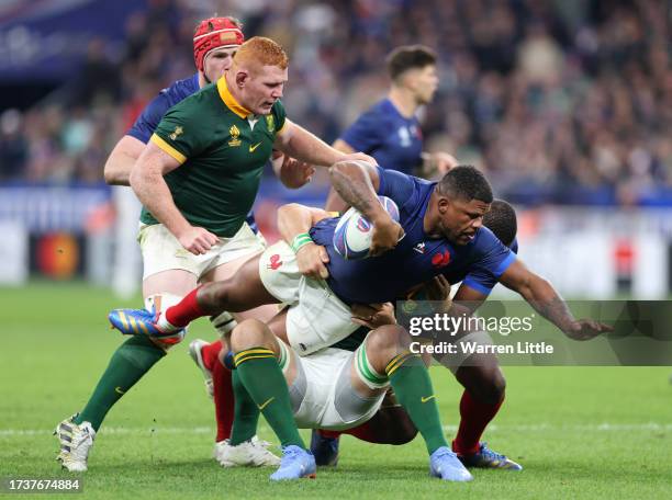 Jonathan Danty of France is tackled by Duane Vermeulen of South Africa during the Rugby World Cup France 2023 Quarter Final match between France and...