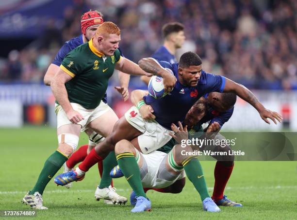 Jonathan Danty of France is tackled by Duane Vermeulen of South Africa during the Rugby World Cup France 2023 Quarter Final match between France and...