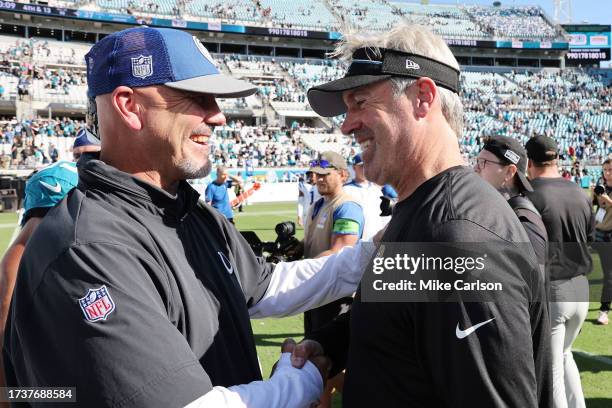 Indianapolis Colts defensive coordinator Gus Bradley shakes hands with Jacksonville Jaguars head coach Doug Pederson after the game at EverBank...