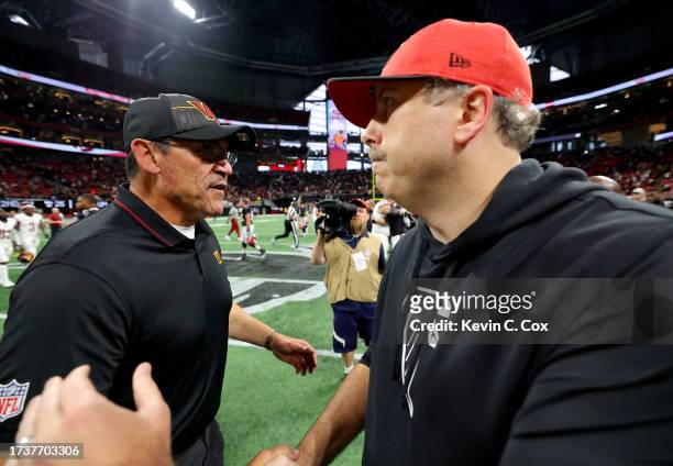 Head coach Ron Rivera of the Washington Commanders and head coach Arthur Smith of the Atlanta Falcons hug after Washington's 24-16 win at...
