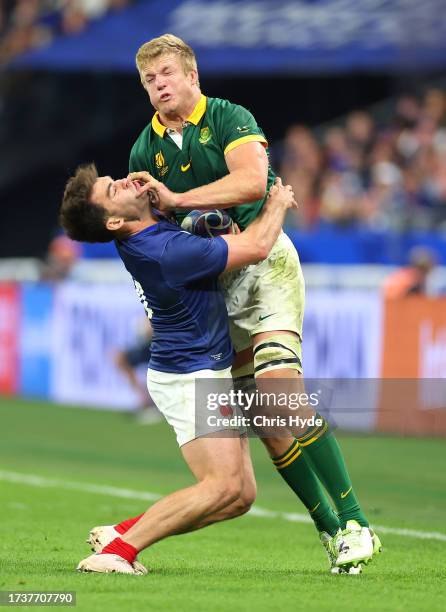 Pieter-Steph Du Toit of South Africa is tackled by Damian Penaud of France during the Rugby World Cup France 2023 Quarter Final match between France...