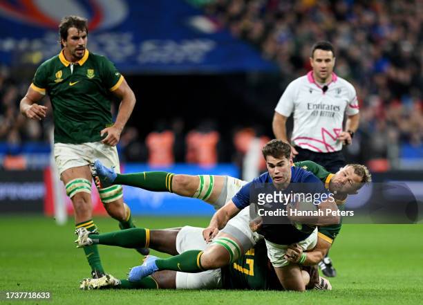 Matthieu Jalibert of France is tackled by Duane Vermeulen and Ox Nche of South Africa during the Rugby World Cup France 2023 Quarter Final match...