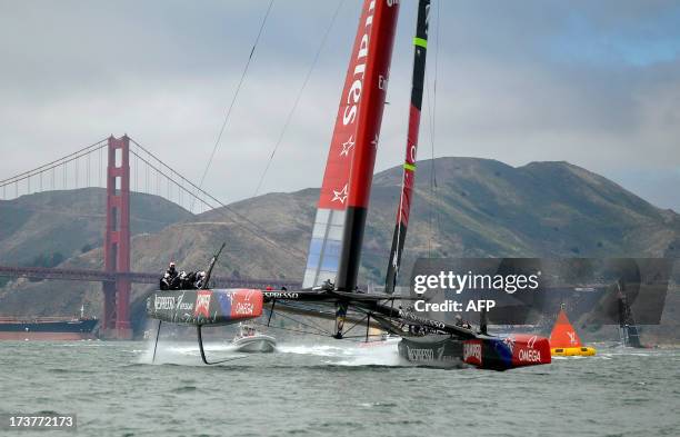 Team Emirates New Zealand , and Team Oracle USA sail their AC-72 Racing Yachts near the Golden Gate Bridge during a training session for the...