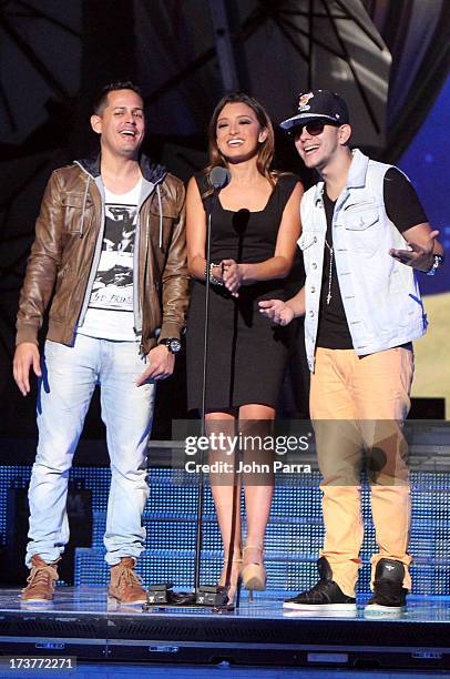 Antonietta Collins speaks onstage with Angel y Khriz during rehearsal for Premios Juventud 2013 at Bank United Center on July 17, 2013 in Miami,...