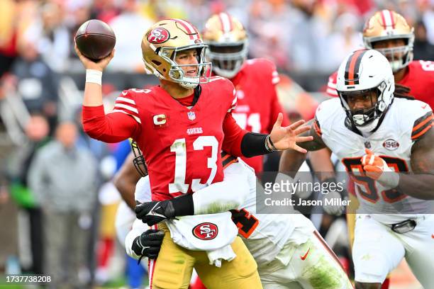 Brock Purdy of the San Francisco 49ers attempts a pass while pressured by Ogbo Okoronkwo of the Cleveland Browns during the fourth quarter at...