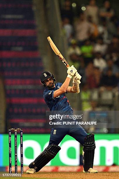 England's Mark Wood plays a shot during the 2023 ICC Men's Cricket World Cup one-day international match between England and South Africa at the...