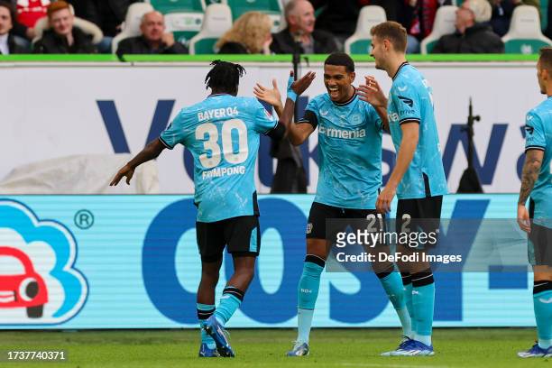 Jeremie Frimpong of Bayer 04 Leverkusen celebrates after scoring his teams first goal with Amine Adli of Bayer 04 Leverkusen and Josip Stanisic of...