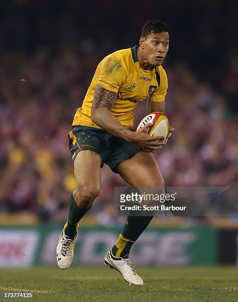 Israel Folau of the Wallabies runs with the ball during game two of the International Test Series between the Australian Wallabies and the British &...