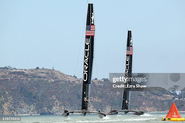Oracle Team USA sail both of their AC72's while training for the America's Cup sailing event on July 17, 2013 in San Francisco, California. Emirates...