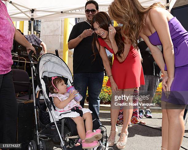 Roselyn Sanchez and her daughter Sebella Rose Winter visit "Extra" at The Grove on July 17, 2013 in Los Angeles, California.