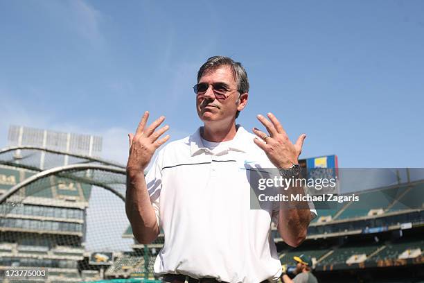 General Manager Billy Beane of the Oakland Athletics stands on the field prior to the game against the Chicago Cubs at O.co Coliseum on July 3, 2013...