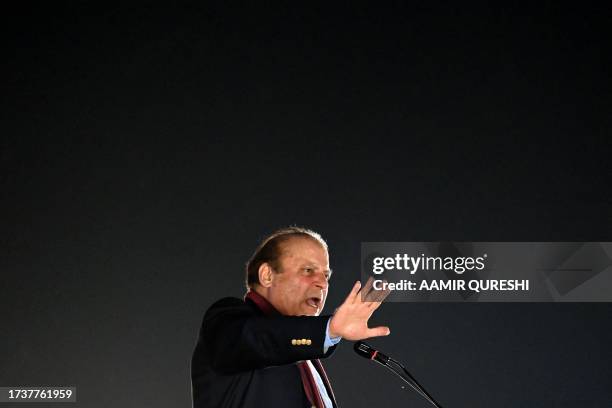 Pakistan's former Prime Minister Nawaz Sharif addresses his supporters gathered at a park during an event held to welcome him in Lahore on October...