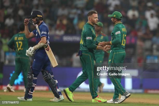 South Africa team members celebrate their team's win over England during the ICC Men's Cricket World Cup 2023 match between England and South Africa...