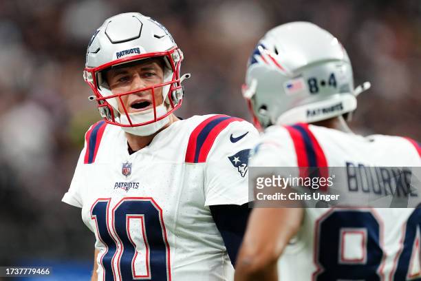 Mac Jones of the New England Patriots reacts after throwing an interception during the second quarter against the Las Vegas Raiders at Allegiant...