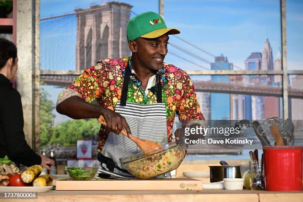 Marcus Samuelsson gives a culinary demonstration during the Food Network New York City Wine & Food Festival presented by Capital One - Grand Tasting...