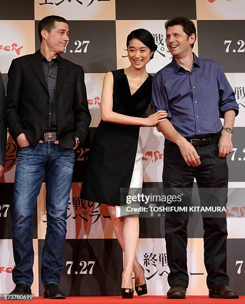 Film director Peter Webber and Japanese actress Eriko Hatsune smile as US actor Matthew Fox looks on during a press conference for their latest film...