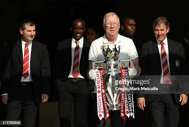Dennis Irwin, Dwight Yorke, Andy Cole and Bryan Robson arrive with the Barclays Premier League trophy during the official Manchester United official...