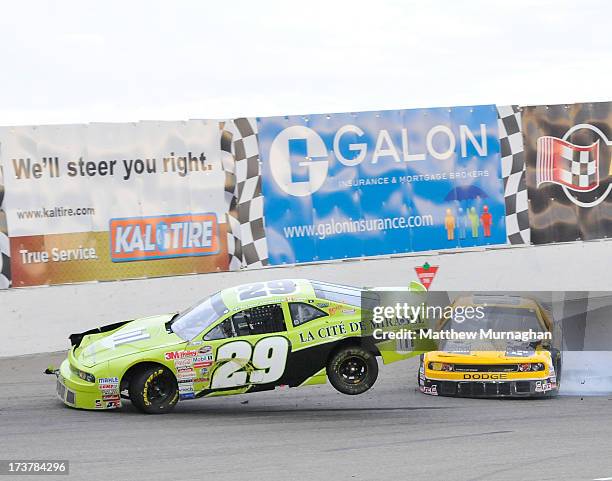 Ray Courtemanche Jr., driver of the No. 29 La Cite De Mirabel Inc. Dodge lands after an incident with Ryley Seibert, driver of the No. 09 Lake...