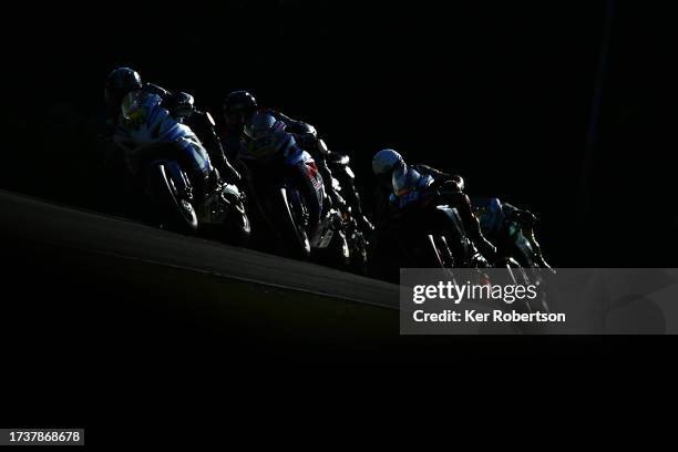 Joe Francis of STAUFF Fluid Power / GR Motosport Kawasaki leads a group of riders during the Pirelli National Superstock race at Brands Hatch on...