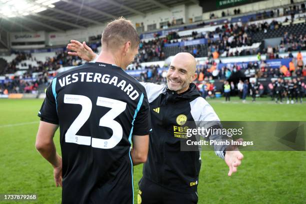 Leicester City Manager Enzo Maresca celebrates with Jannik Vestergaard of Leicester City after the Sky Bet Championship match between Swansea City...