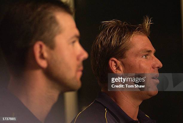 Ricky Ponting of Australia looks on as Shane Warne of Australia talks to the press to announce his retirement from One Day International cricket...