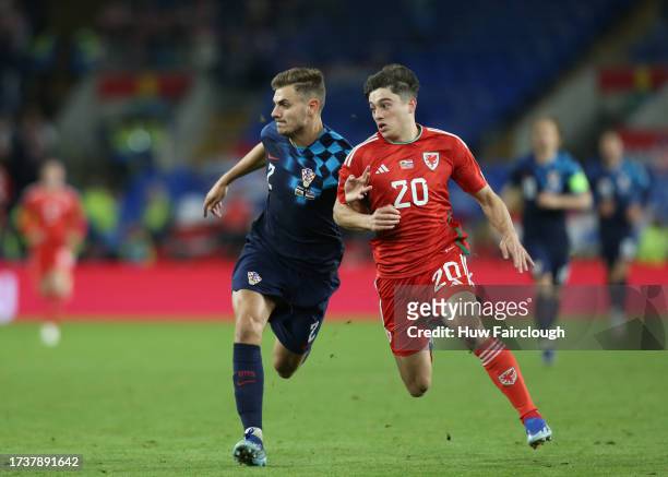 Daniel James of Wales is challenged by Josip Stanisic of Croatia during the UEFA EURO 2024 European qualifier match between Wales and Croatia at...