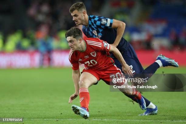 Daniel James of Wales is challenged by Josip Stanisic of Croatia during the UEFA EURO 2024 European qualifier match between Wales and Croatia at...