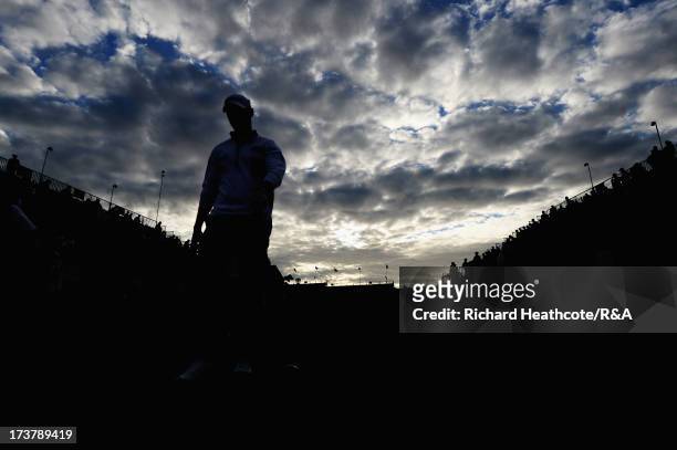 Lloyd Saltman of Scotland walks down the 1st hole during the first round of the 142nd Open Championship at Muirfield on July 18, 2013 in Gullane,...