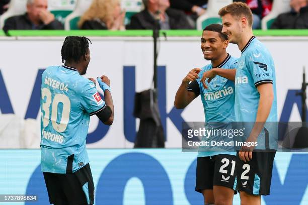 Jeremie Frimpong of Bayer 04 Leverkusen celebrates after scoring his teams first goal with Amine Adli of Bayer 04 Leverkusen and Josip Stanisic of...