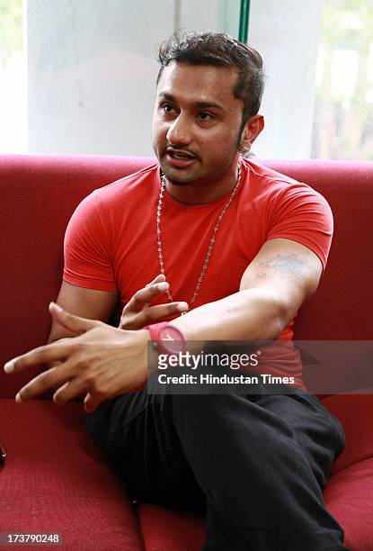 Indian Punjabi and Bollywood singer Honey Singh poses for the camera during an exclusive profile shoot at HT Media office on July 9, 2013 in New...