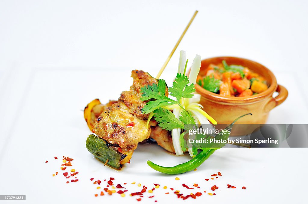 Chicken skewers, papaya salsa