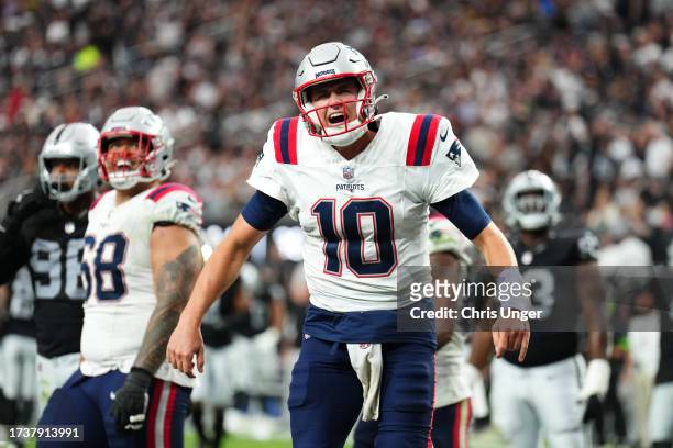 Mac Jones of the New England Patriots reacts after his team's touchdown during the fourth quarter against the Las Vegas Raiders at Allegiant Stadium...