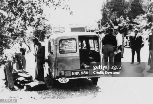French police at the scene of the murders of British biochemist Sir Jack Drummond , his wife Anne and their 10 year-old daughter Elizabeth on a road...